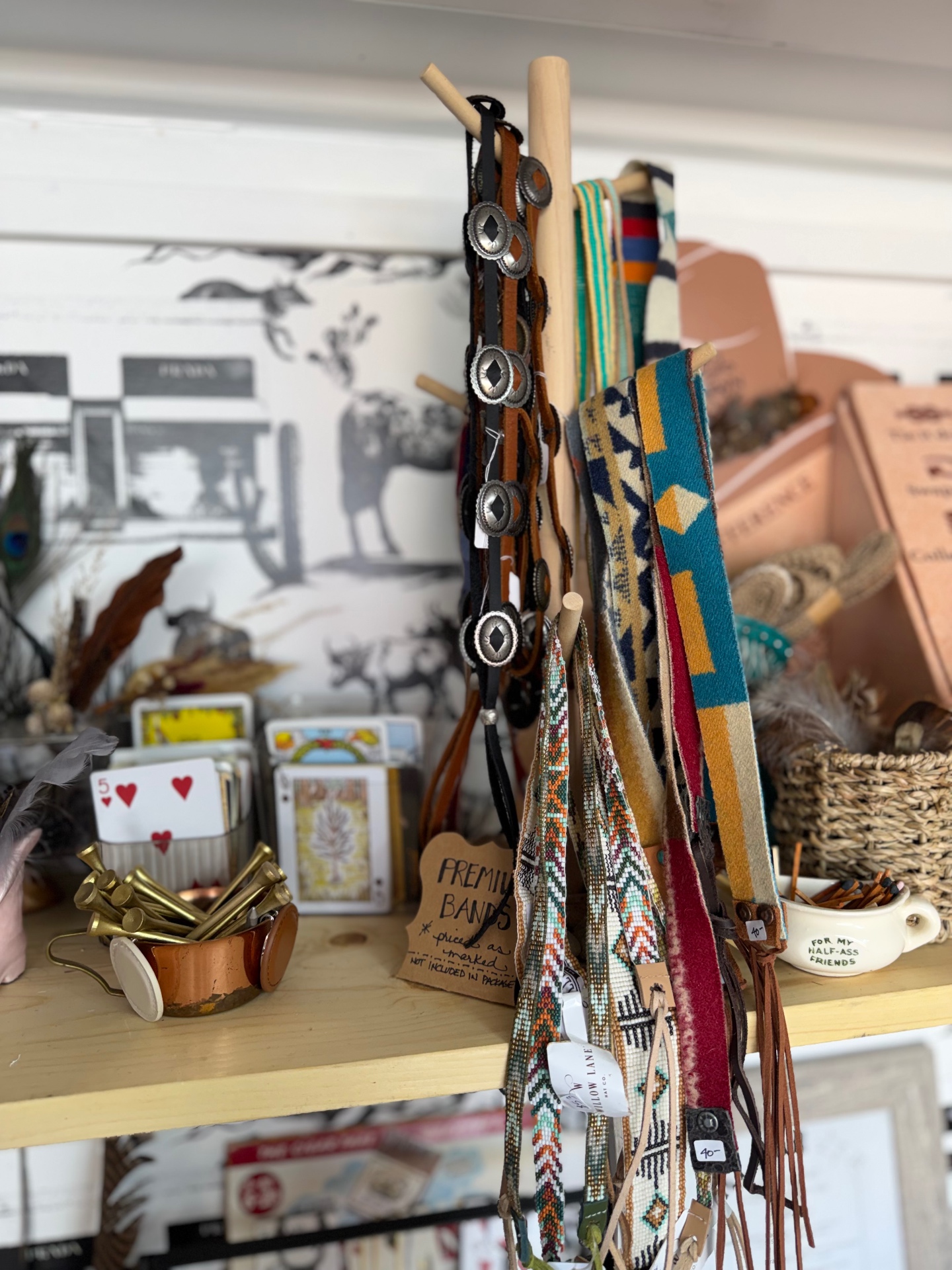 Beaded, leather and woven hat bands on display